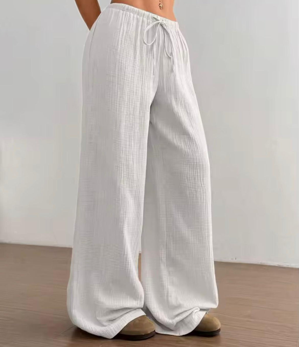 Pantalone largo donna tessuto crinkle bianco, vita elastica con coulisse, fit palazzo