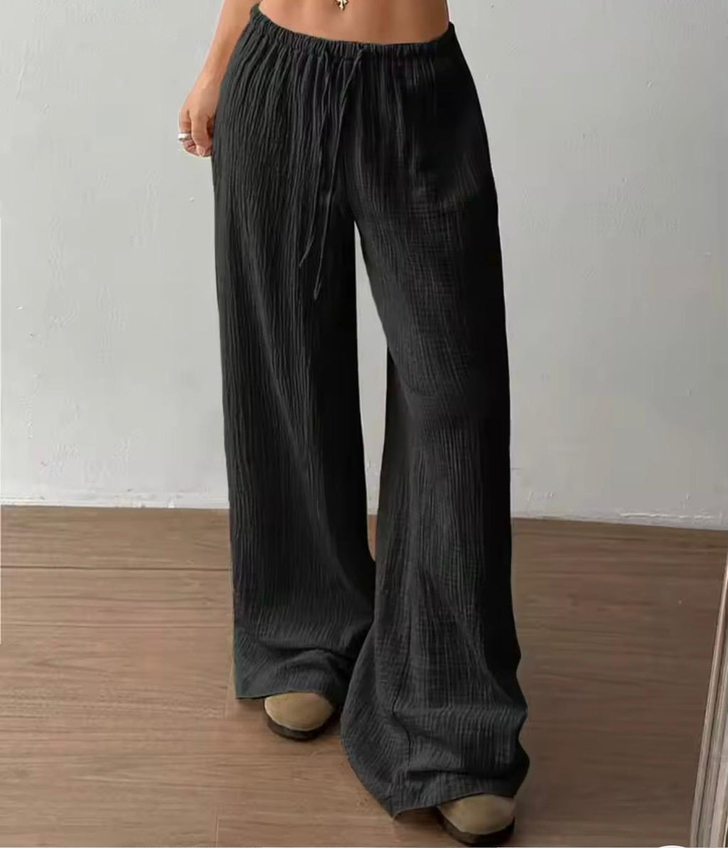 Pantalone largo donna tessuto crinkle nero, vita elastica con coulisse