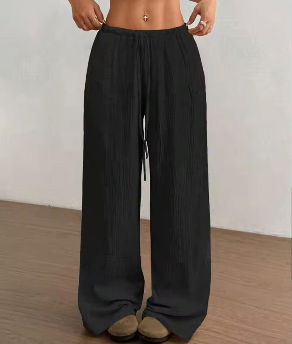 Pantalone largo donna tessuto crinkle nero, vita elastica con coulisse